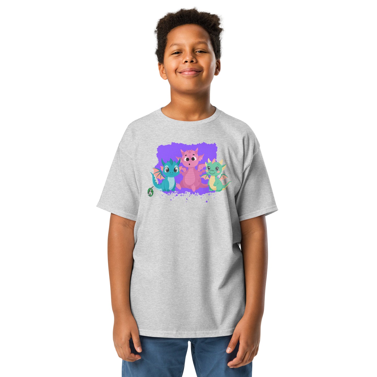 A boy standing and wearing a grey t-shirt featuring a printed graphic of colorful dragons, designed by Wizard Prints.