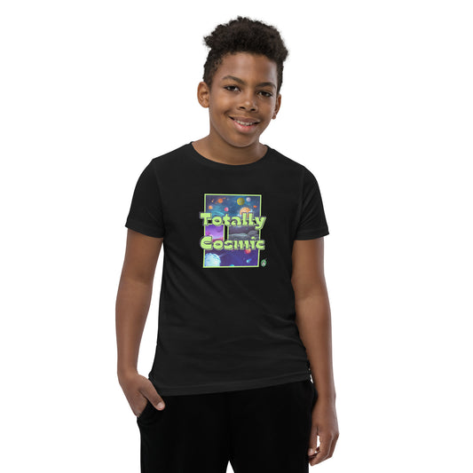 A boy standing wearing a black kids t-shirt with a graphic of the cosmos and the words Totally Cosmic, by Wizard Prints