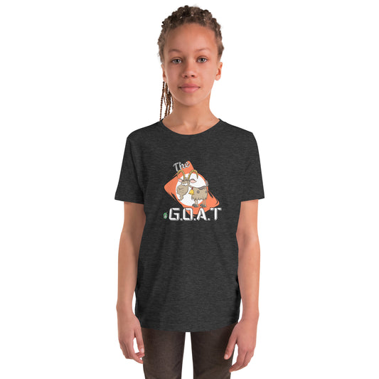 A girl standing wearing a dark grey kids tee shirt with a graphic of a goat with the word G.O.A.T as in Greatest of all Time by Wizard Prints and jeans on a white background