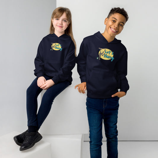 A boy standing and a girl sitting wearing a navy hoodie with a funny graphic on the front of a monkey hanging from the tree branch saying, Let's Hang by Wizard Prints and jeans on a grey background