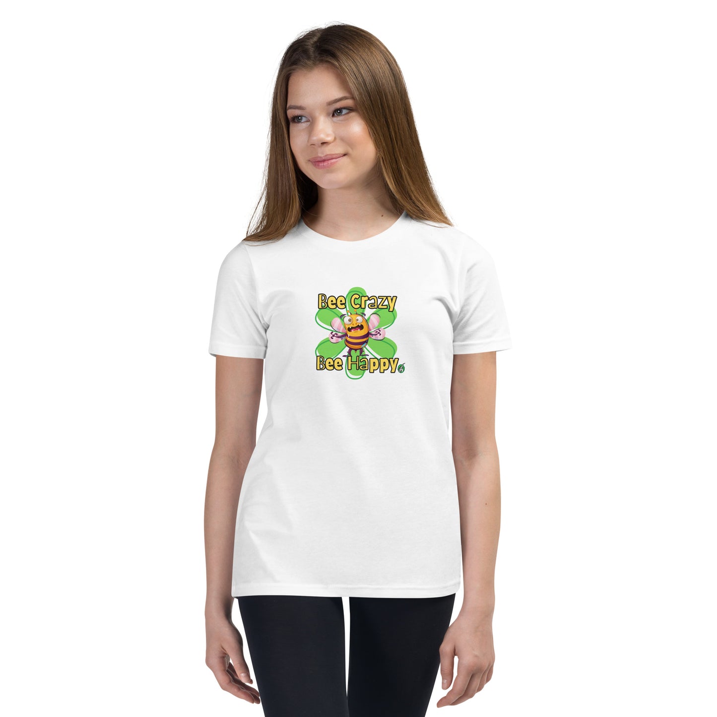 A girl standing wearing a white kids t-shirt with the printed graphic of a crazy bee and the statement, Bee Crazy Bee Happy. Designed by Wizard Prints