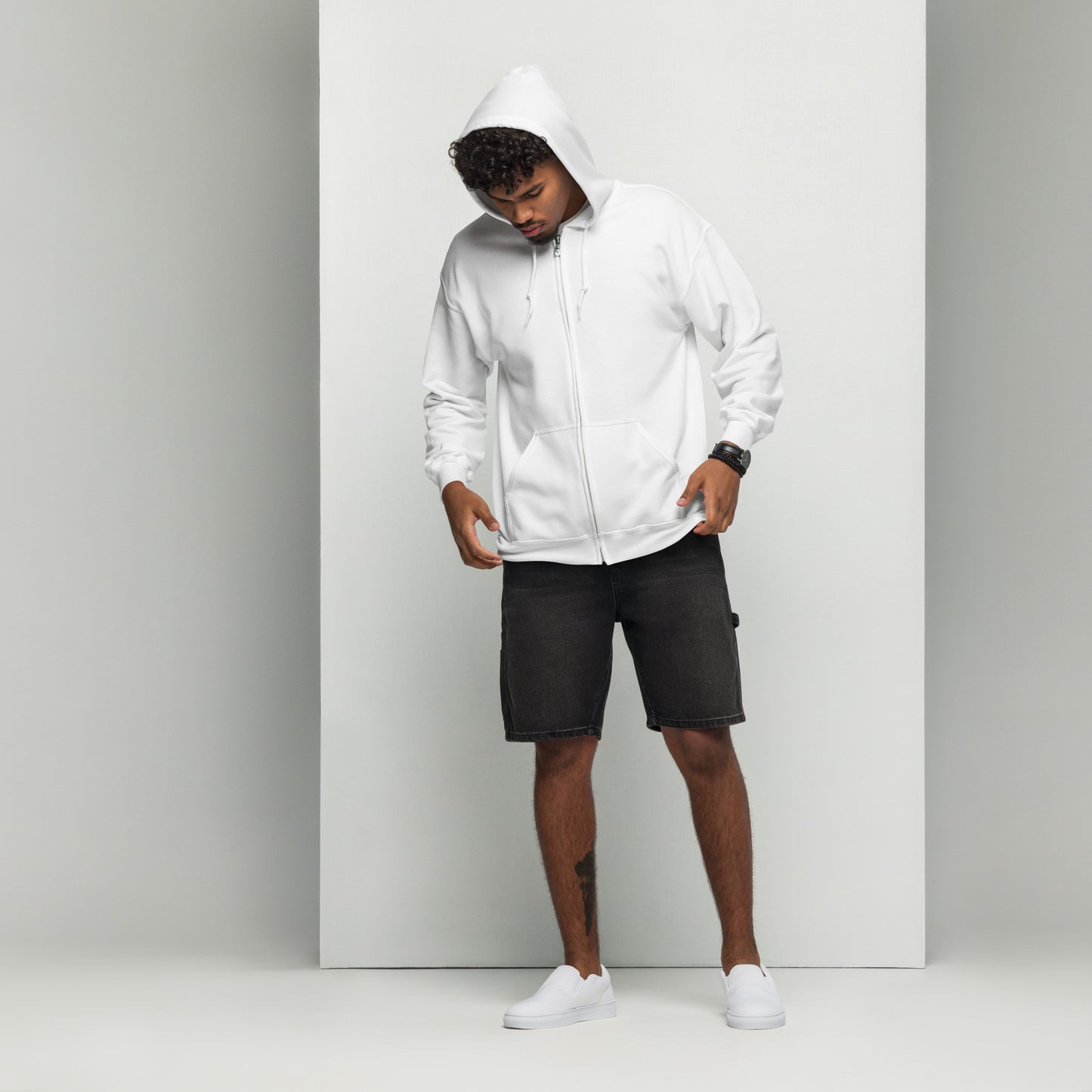 A man standing wearing a white zip through hoodie with a plain front by Wizard Prints Shop