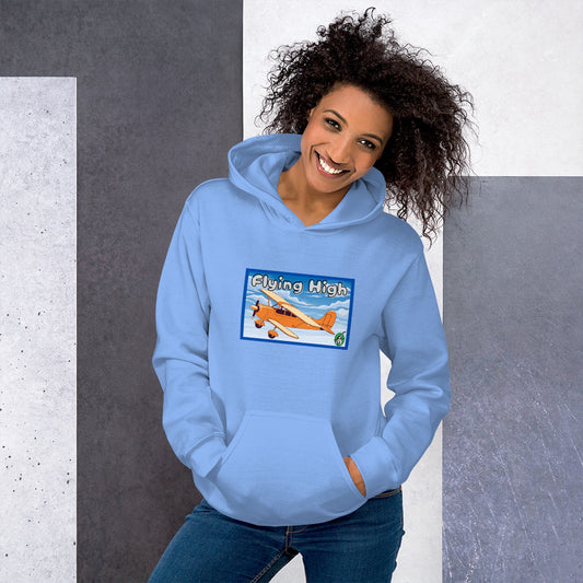 A woman standing wearing a light blue hoodie with the printed graphic of a vintage airplane and the words, Flying High, by Wizard Prints.