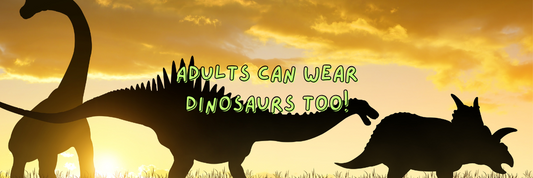 Silhouetted Dinosaurs With Sunset Background Featuring Two Types of Sauropod and a Triceratops With Slogan "Adults Can Wear Dinosaurs Too!"