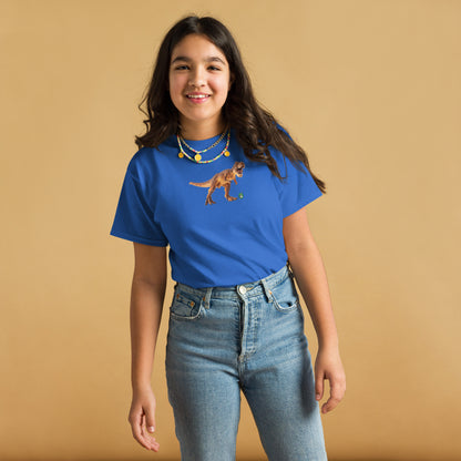 A girl standing wearing a blue t-shirt featuring a printed graphic of a life like dinosaur, designed by Wizard Prints.