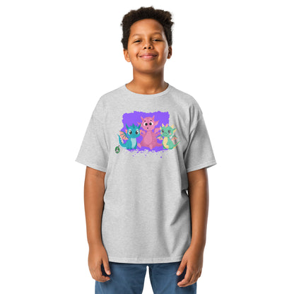 A boy standing and wearing a grey t-shirt featuring a printed graphic of colorful dragons, designed by Wizard Prints.