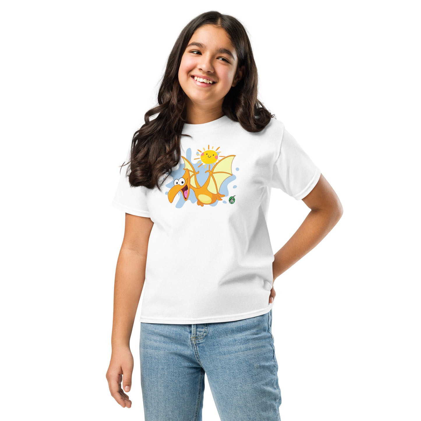 A girl standing and wearing a white t-shirt with a printed graphic of a cartoon flying dragon and the sun. Designed by Wizard Prints.