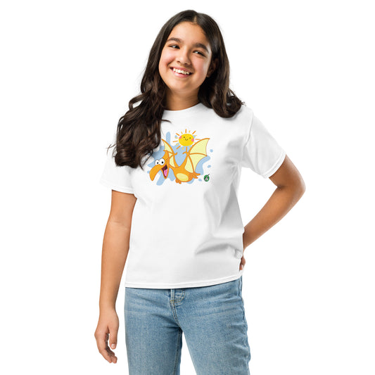 A girl standing and wearing a white t-shirt with a printed graphic of a cartoon flying dragon and the sun. Designed by Wizard Prints.