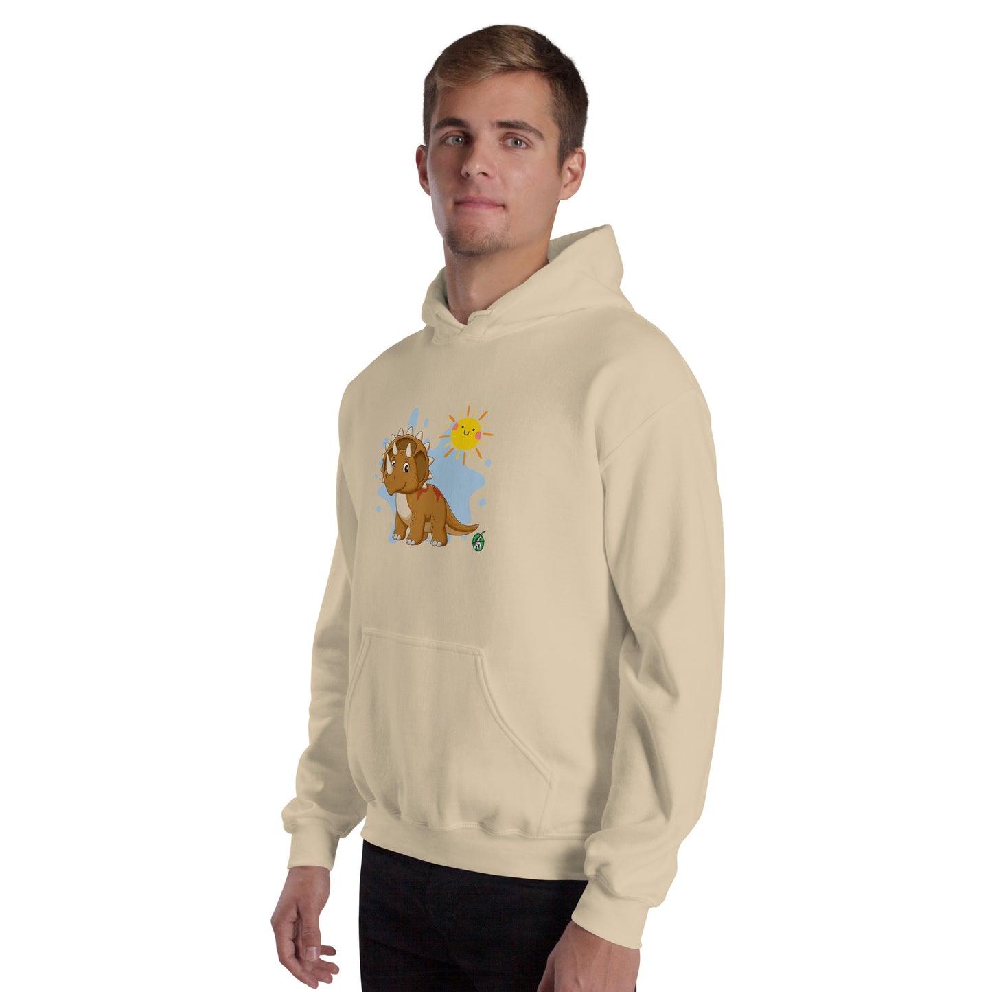 A man standing wearing a beige hoodie with a printed graphic of a smiling cartoon dinosaur and the sun. Designed by Wizard Prints
