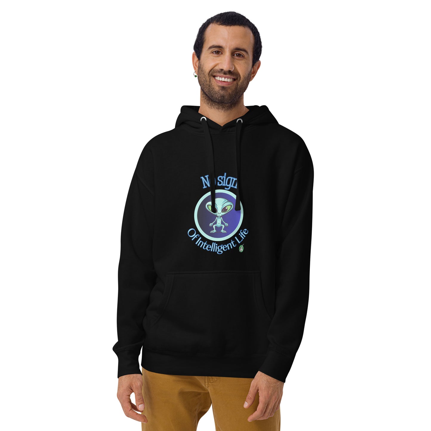 A man standing wearing a black hoodie with a printed graphic of an alien on a blue background with the words, No Sign of Intelligent Life. Designed by Wizard Prints