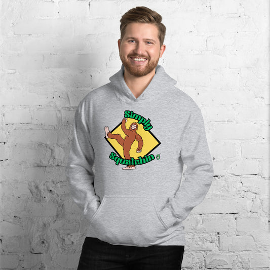 A man standing and wearing a grey hoodie with a printed graphic of a sasquatch with the words, Simply Squatchin. Designed by Wizard Prints.