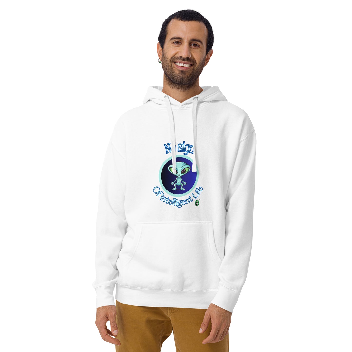 A man standing wearing a white hoodie with a printed graphic of an alien on a blue background with the words, No Sign of Intelligent Life. Designed by Wizard Prints