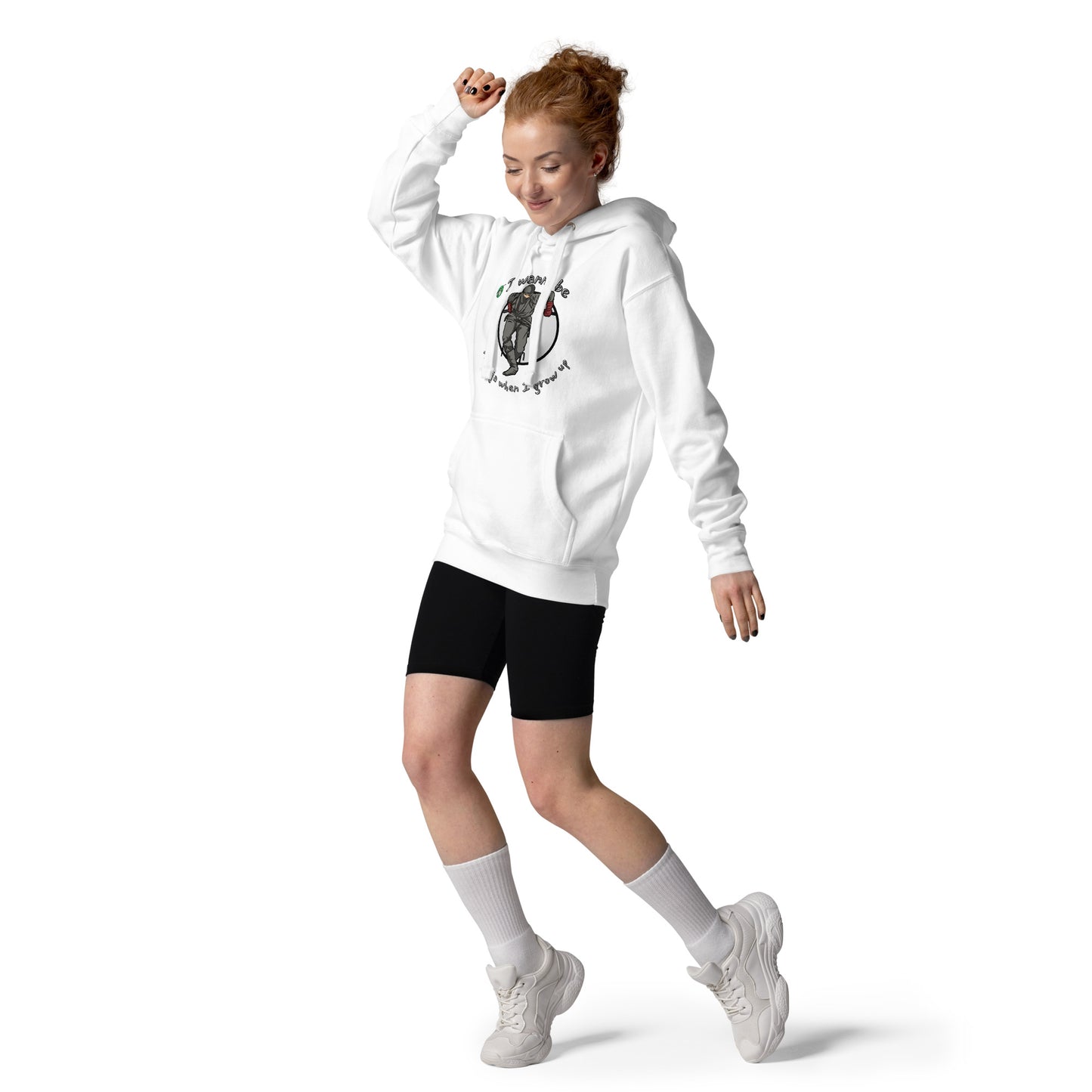 A woman dancing wearing a white hoodie with a printed graphic of a ninja with the words, I wanna be a ninja when I grow up. Designed by Wizard Prints