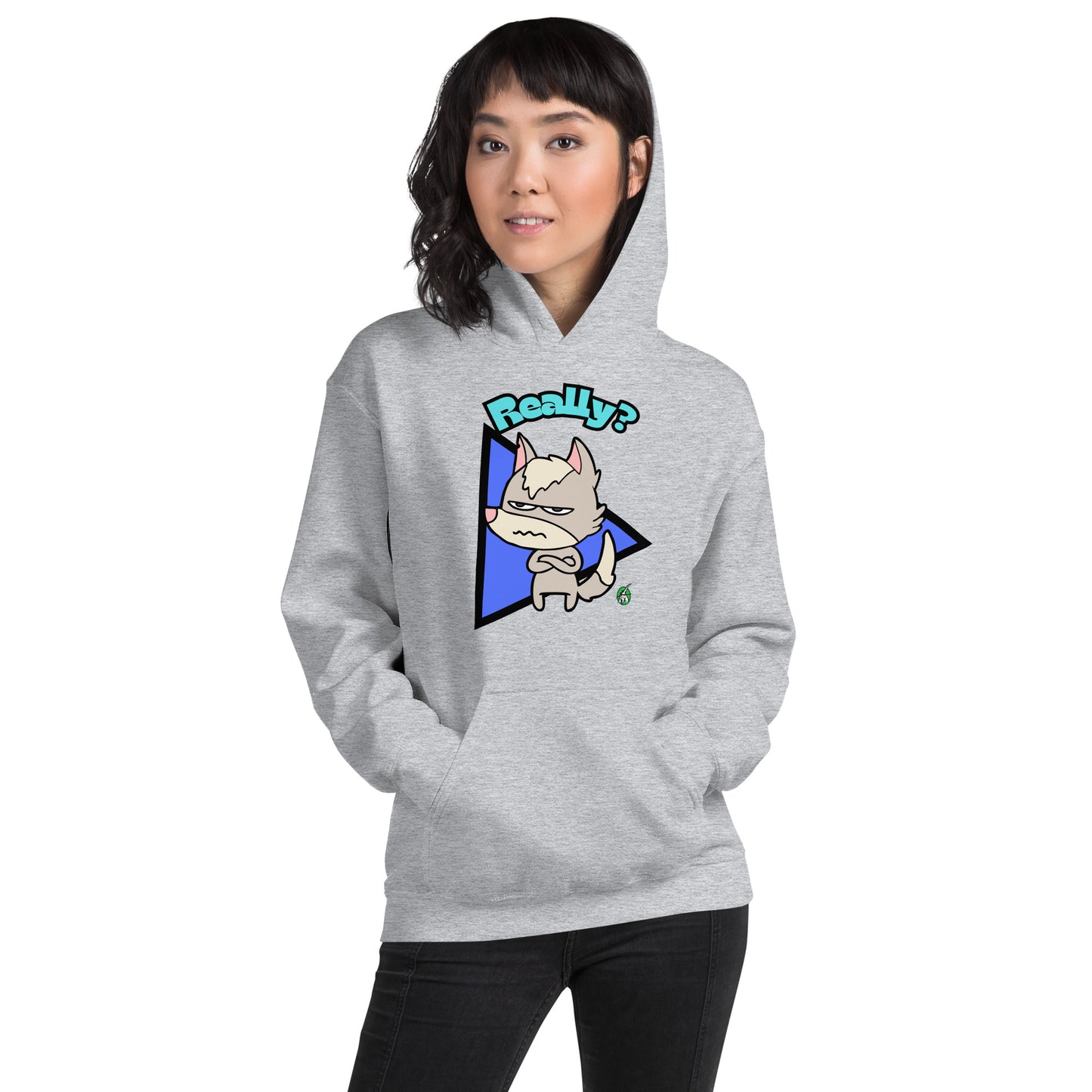 A woman standing and wearing a light grey hoodie with a printed graphic of a grumpy fox with the word, 'Really?'. Designed by Wizard Prints.