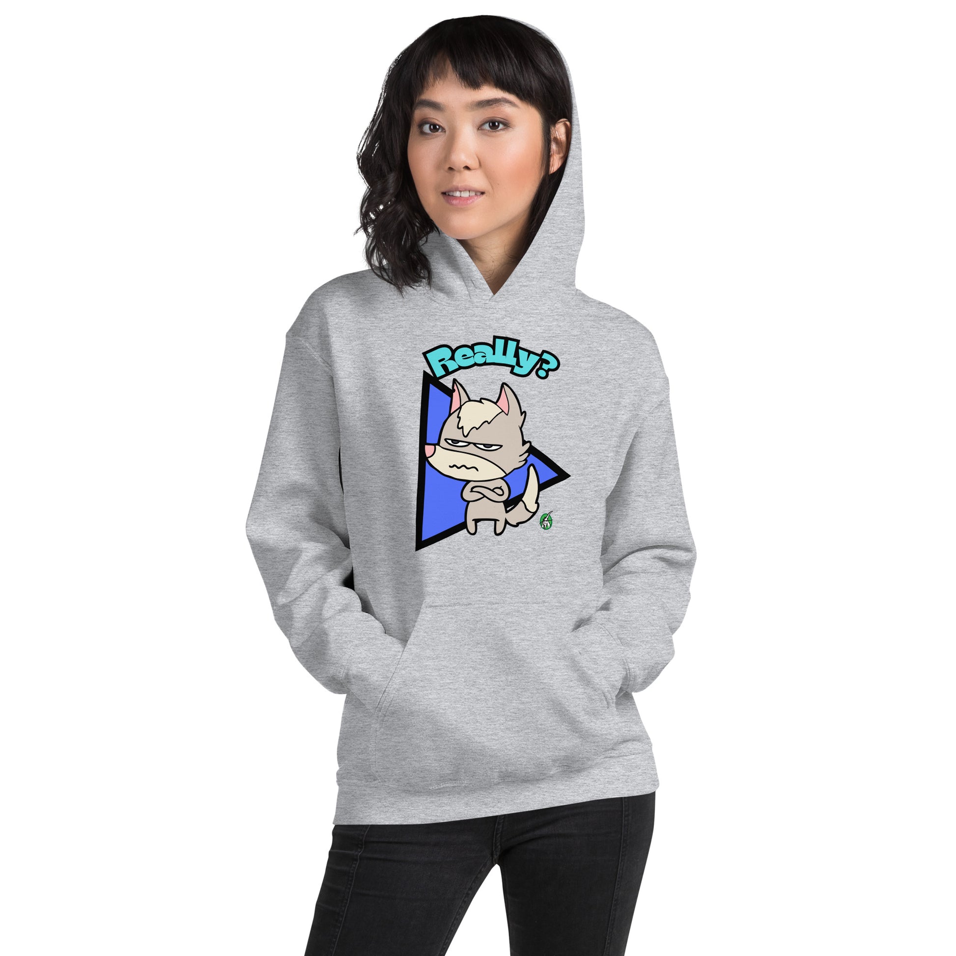 A woman standing and wearing a light grey hoodie with a printed graphic of a grumpy fox with the word, 'Really?'. Designed by Wizard Prints.