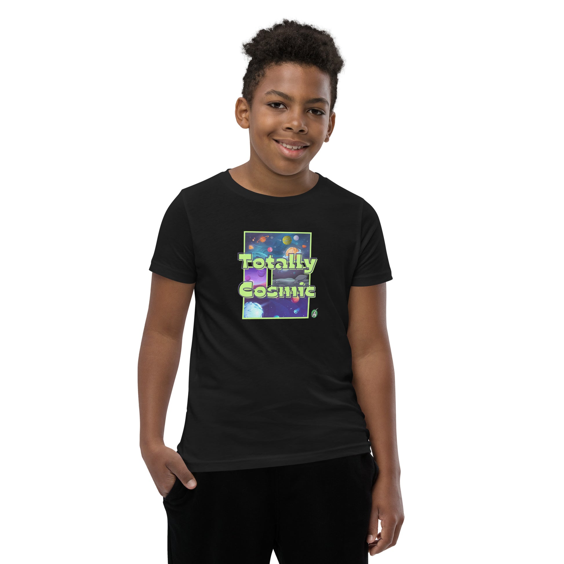 A boy standing wearing a black kids t-shirt with a graphic of the cosmos and the words Totally Cosmic, by Wizard Prints