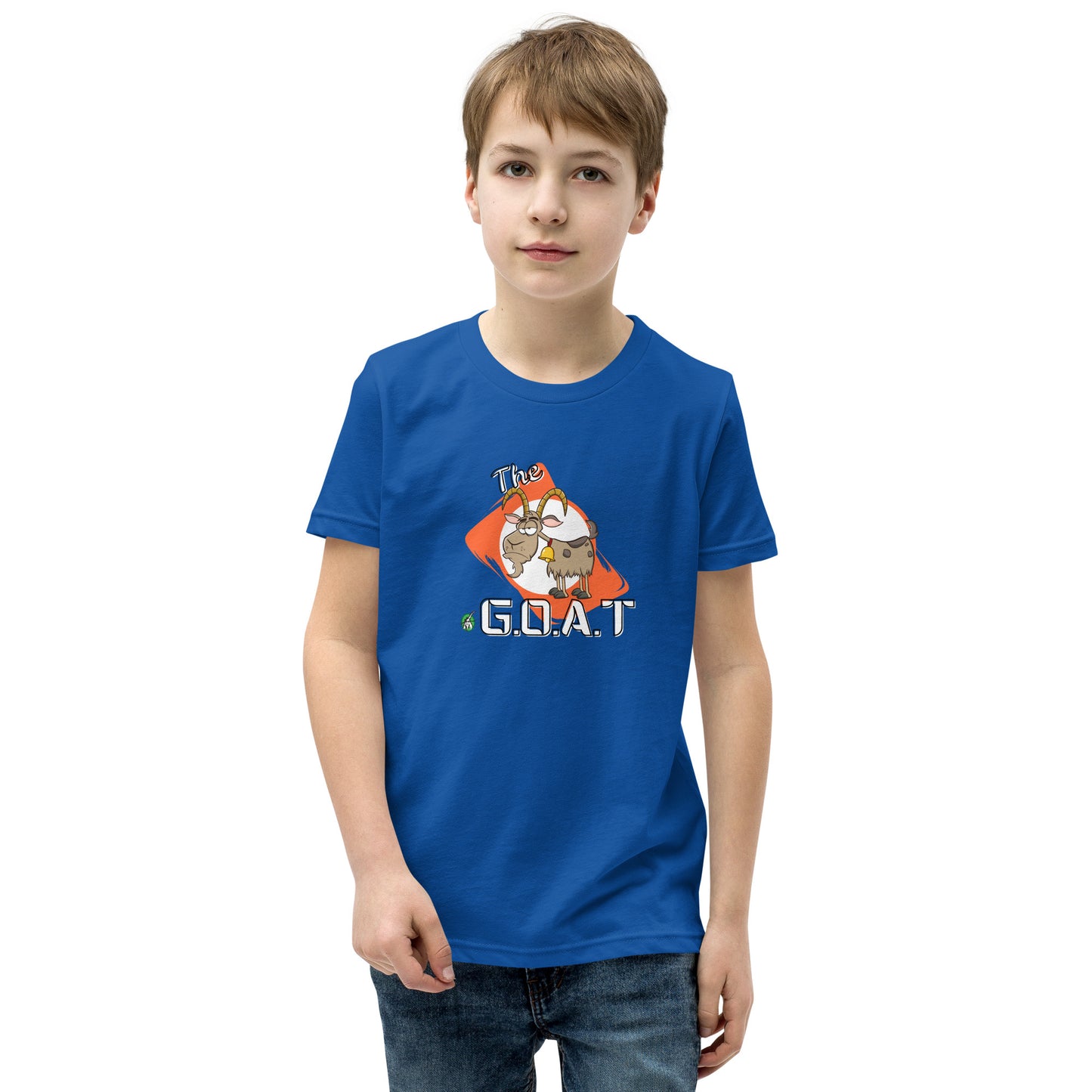 A boy standing wearing a blue kids tee shirt with a graphic of a goat with the word G.O.A.T as in Greatest of all Time by Wizard Prints and jeans on a white background

