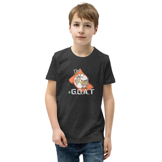 A boy standing wearing a dark grey kids tee shirt with a graphic of a goat with the word G.O.A.T as in Greatest of all Time by Wizard Prints and jeans on a white background