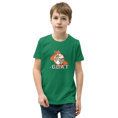 A boy standing wearing a green kids tee shirt with a graphic of a goat with the word G.O.A.T as in Greatest of all Time by Wizard Prints and jeans on a white background
