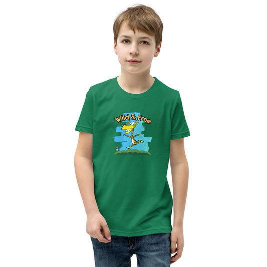 A boy standing wearing a green t-shirt with a funny graphic on the front of a giraffe running with the words, 'wild and free'  by Wizard Prints