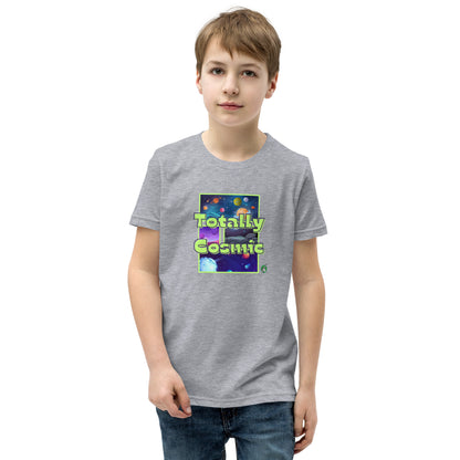A boy standing wearing a grey kids t-shirt with a graphic of the cosmos and the words Totally Cosmic, by Wizard Prints