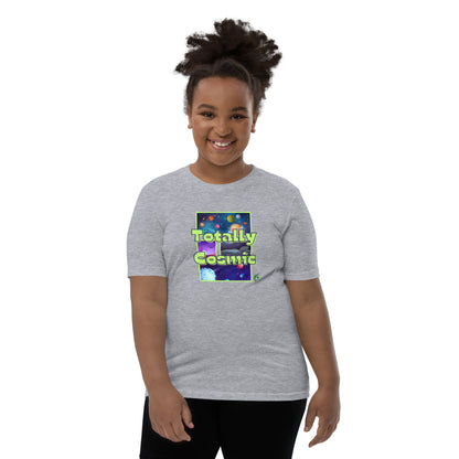 A girl standing wearing a grey kids t-shirt with a graphic of the cosmos and the words Totally Cosmic, by Wizard Prints