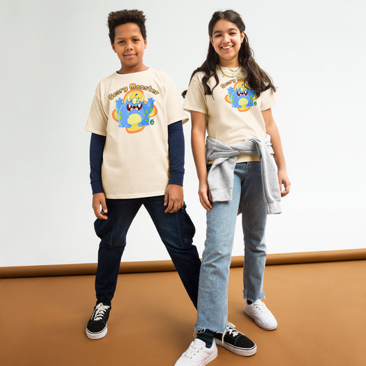 A boy and girl standing and wearing beige t-shirts featuring a printed graphic of a monster and the words, 'Scary Monster'. Designed by Wizards Prints.