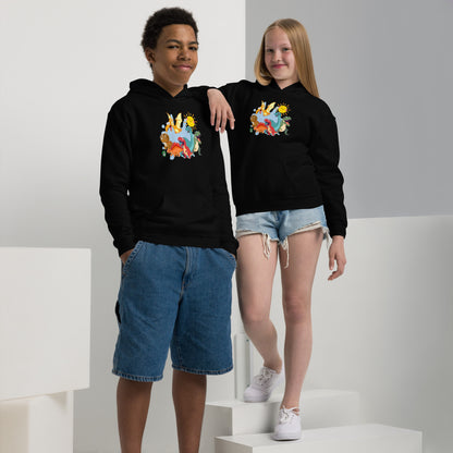 A boy and girl wearing a Wizard Prints kids hoodie in black with a printed graphic on the front of a  group of cartoon dinosaurs
