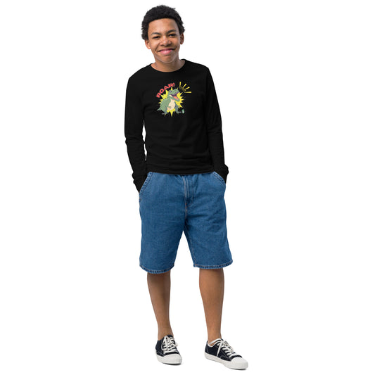 A boy standing and wearing a black long sleeve t-shirt with a printed graphic of a green roaring dinosaur and the word "Roar!", by Wizard Prints.
