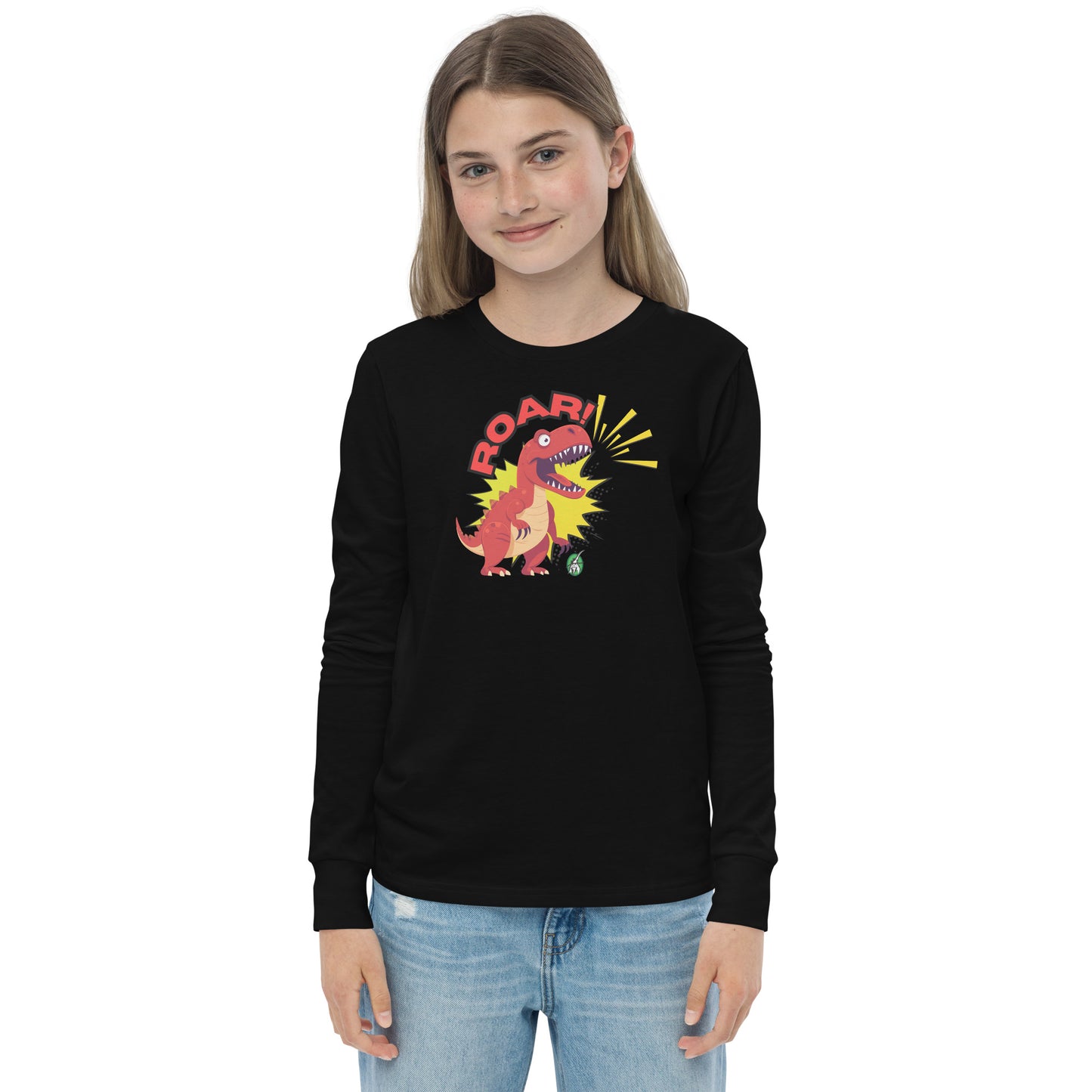 A girl standing and wearing a black long sleeve t-shirt with a printed graphic of a red roaring dinosaur and the word "Roar!", by Wizard Prints.