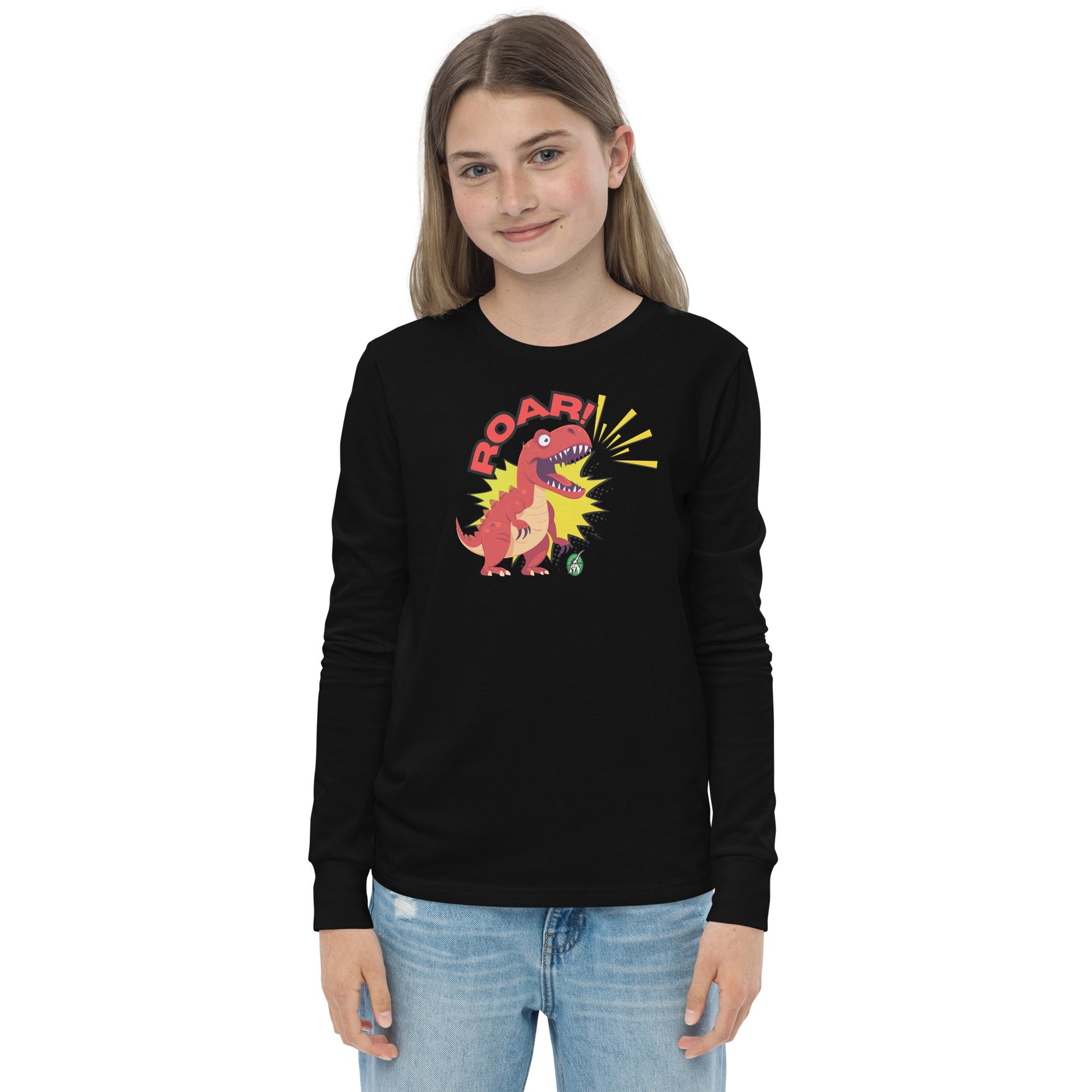 A girl standing and wearing a black long sleeve t-shirt with a printed graphic of a red roaring dinosaur and the word "Roar!", by Wizard Prints.