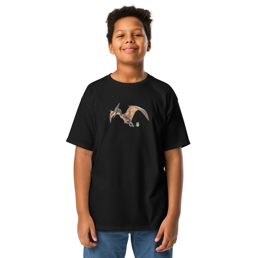 A boy standing wearing a Wizard Prints kids t-shirt in black colour with a printed graphic on the front of a dinosaur 