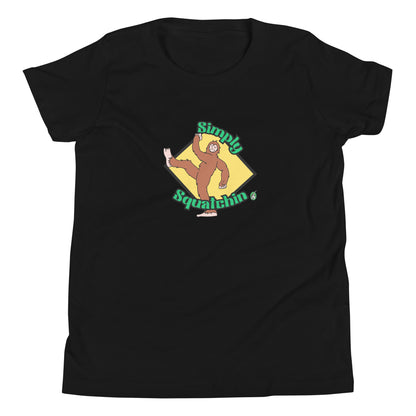 Kids' black graphic t-shirt with a brown sasquatch and the statement, Simply Squatchin on a yellow background, by Wizard Prints