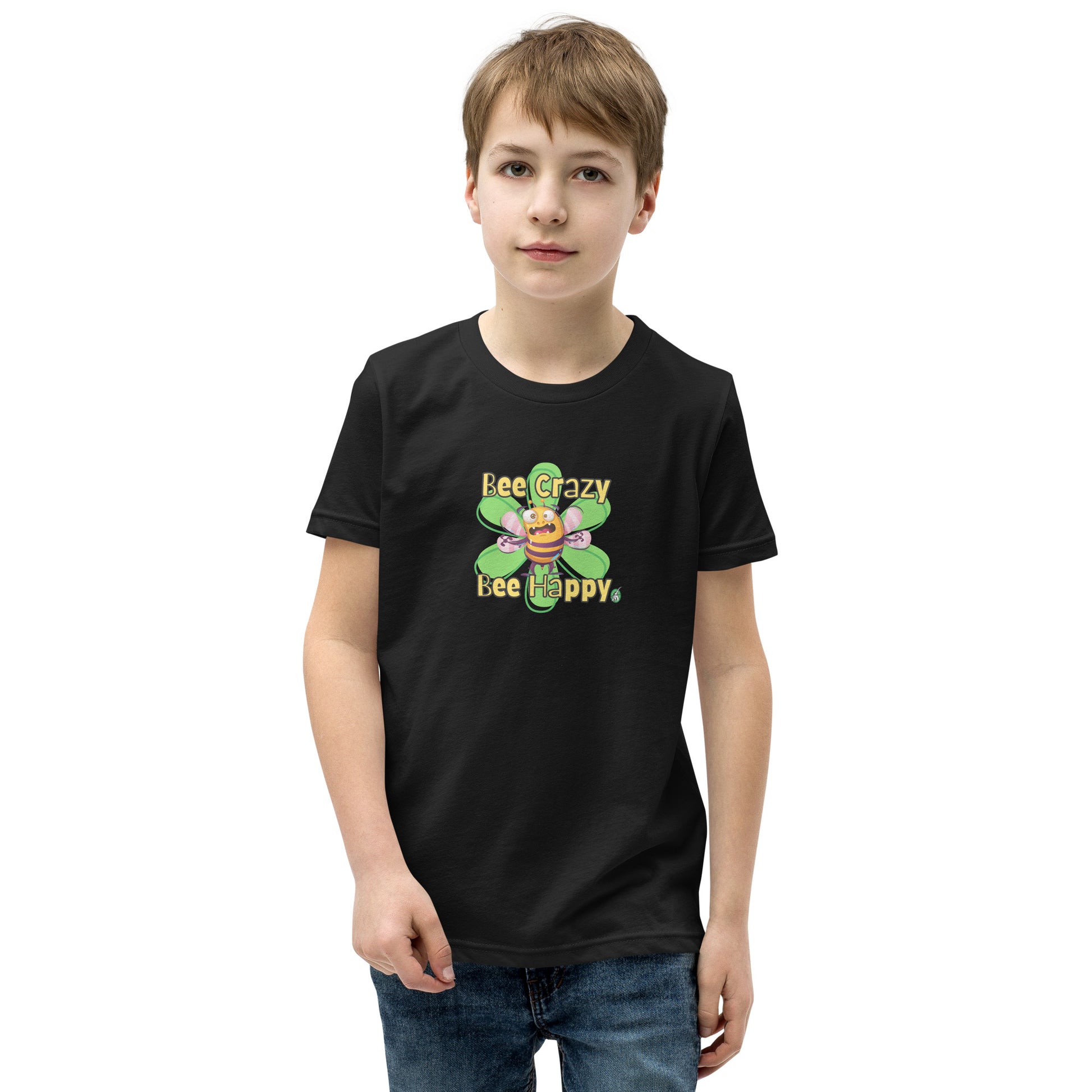  A boy standing wearing a black kids t-shirt with the printed graphic of a crazy bee and the statement, Bee Crazy Bee Happy. Designed by Wizard Prints