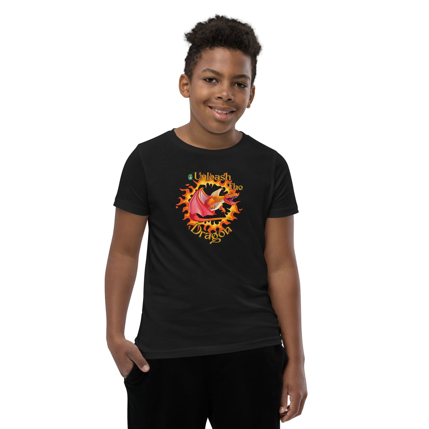  A boy standing wearing a black kids t-shirt with the printed graphic of a fire-breathing dragon with the statement, Unleash the Dragon. Designed by Wizard Prints