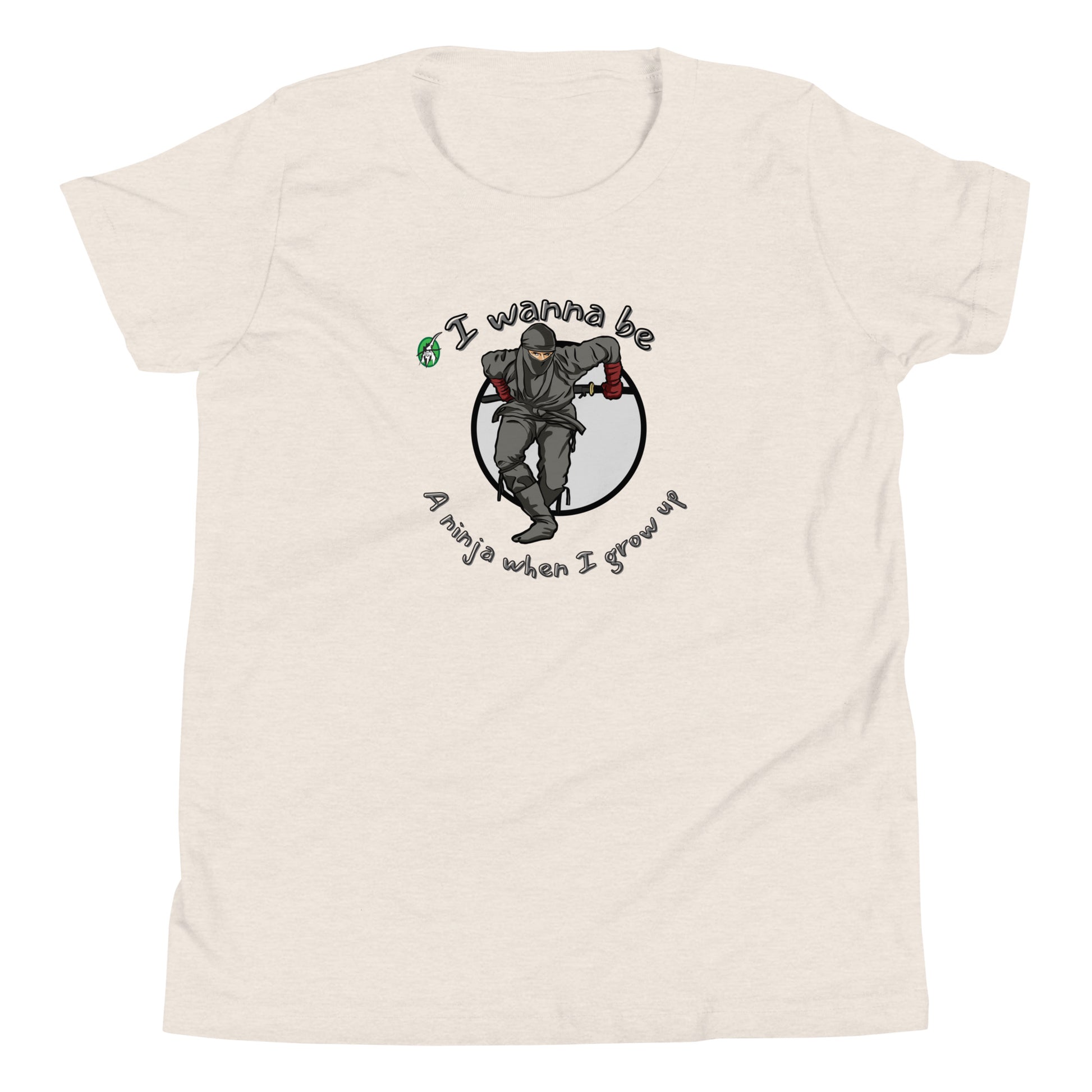 A cream kids graphic tee shirt with a ninja and the words I wanna be a ninja when I grow up, by Wizard Prints