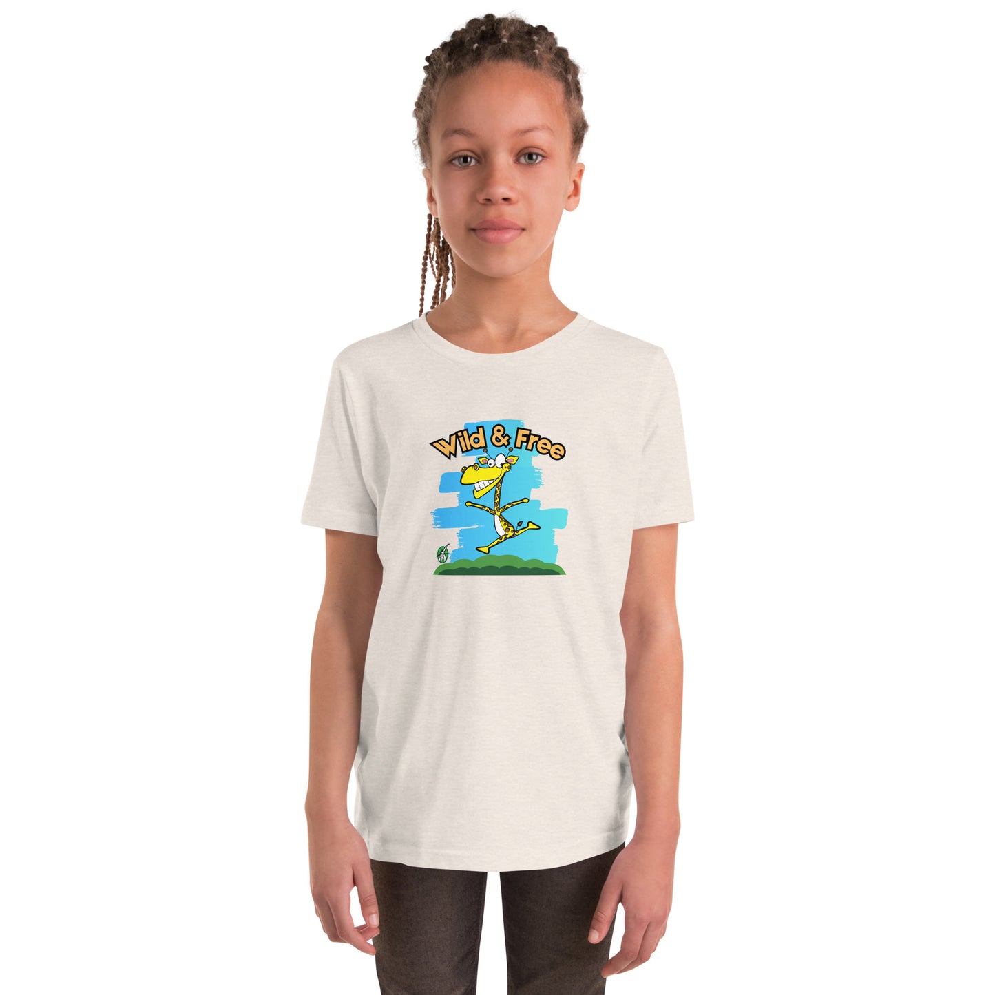 A girl standing wearing a cream t-shirt with a funny graphic on the front of a giraffe running with the words, 'wild and free'  by Wizard Prints