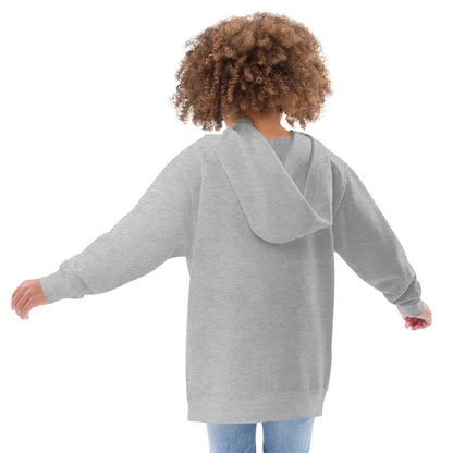 A girl wearing a Wizard Prints kids hoodie in grey standing to show the back of the hoodie