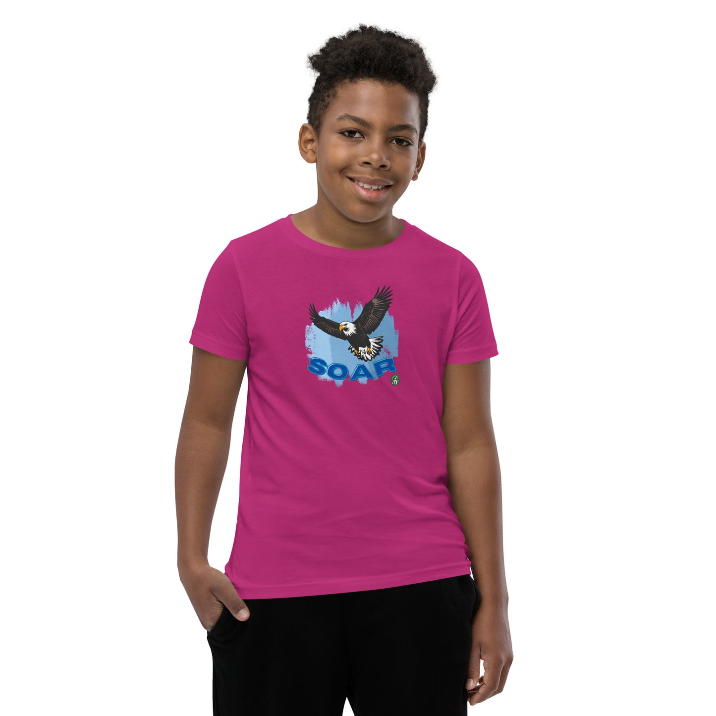 A boy wearing a Wizard Prints kids t-shirt in berry colour with a printed graphic on the front of an eagle soaring in the sky.