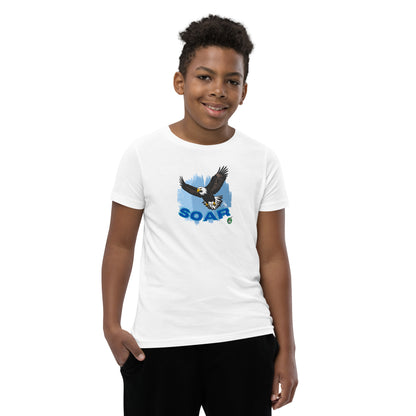 A boy wearing a Wizard Prints kids t-shirt in white with a printed graphic on the front of an eagle soaring in the sky.