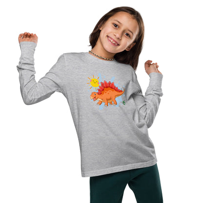 A girl standing and wearing a grey long sleeve t-shirt with a printed graphic of an orange dinosaur and the sun, by Wizard Prints.