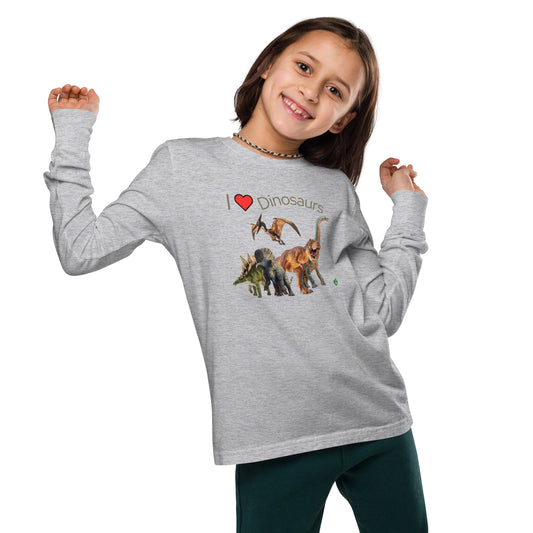 A girl standing and wearing a grey long-sleeve T-shirt featuring a printed graphic of life like dinosaurs and the words "I love Dinosaurs", by Wizard Prints.