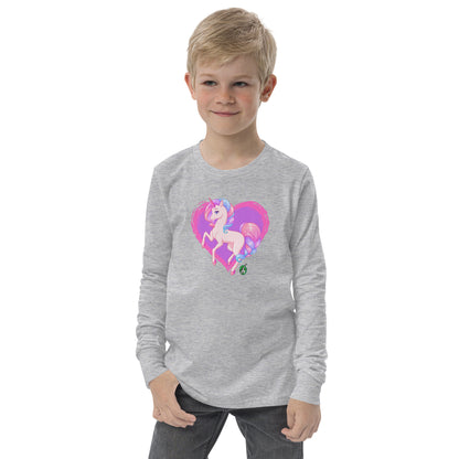 A boy standing and wearing a grey long-sleeve T-shirt featuring a printed graphic of a pink unicorn on a purple heart background, by Wizard Prints.
