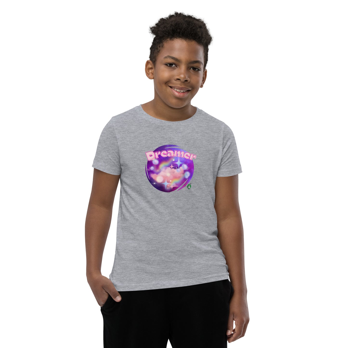  A boy standing wearing a grey kids t-shirt with the printed graphic of a galaxy and the word, Dreamer, by Wizard Prints