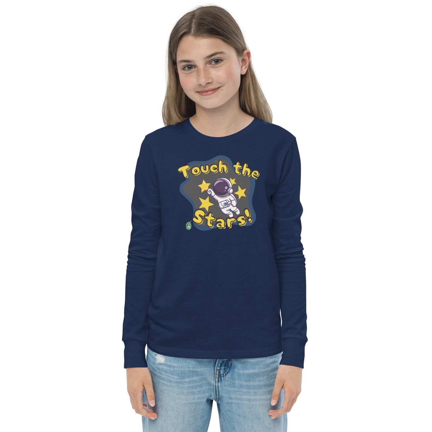A girl standing wearing a navy blue long sleeve t-shirt with a printed graphic of an astronaut and the words, 'Touch the Stars'. Designed by Wizard Prints.