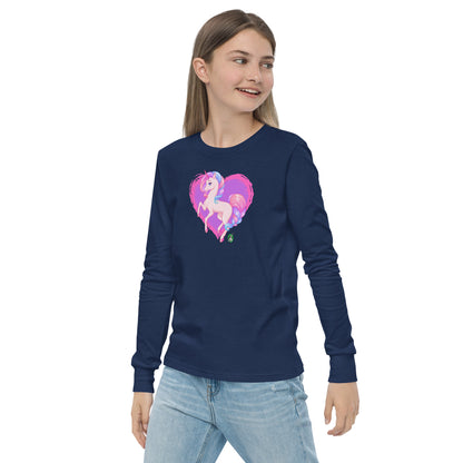 A girl standing and wearing a navy blue long-sleeve T-shirt featuring a printed graphic of a pink unicorn on a purple heart background, by Wizard Prints.