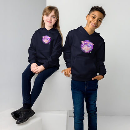 A boy standing and a girl sitting both wearing a navy kids graphic hoodie with dreamy purple cirlcle and the word Dreamer by Wizard Prints
