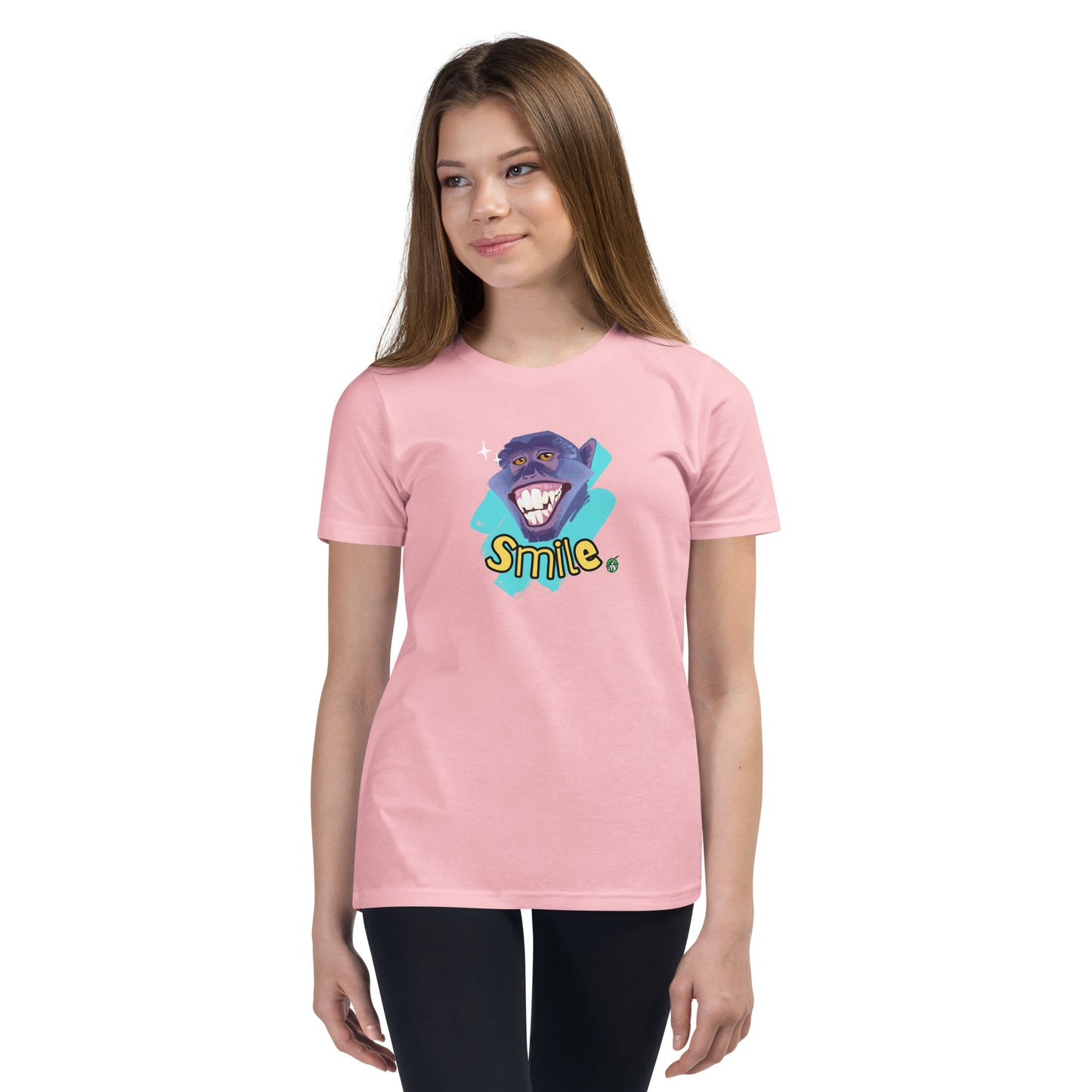  A girl standing wearing a pink kids t-shirt with the printed graphic of a smiling monkey and the word, Smile. Designed by Wizard Prints