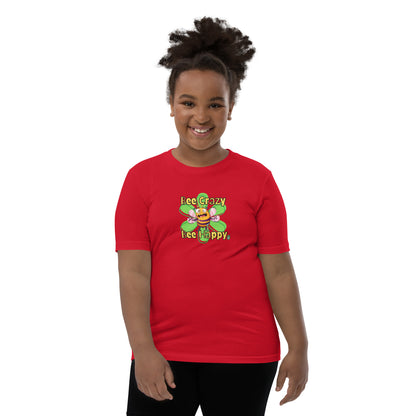  A red standing wearing a red kids t-shirt with the printed graphic of a crazy bee and the statement, Bee Crazy Bee Happy. Designed by Wizard Prints