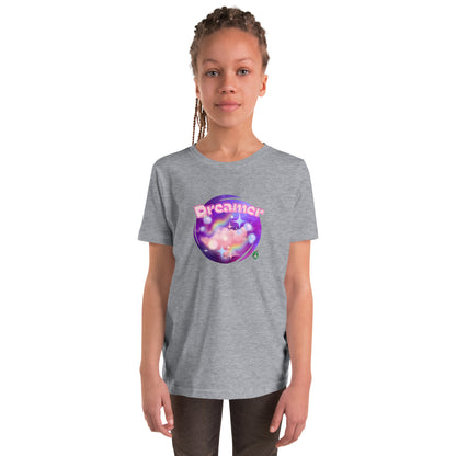 A girl standing wearing a grey kids graphic t-shirt with the word Dreamer on a galaxy background, by Wizard Prints